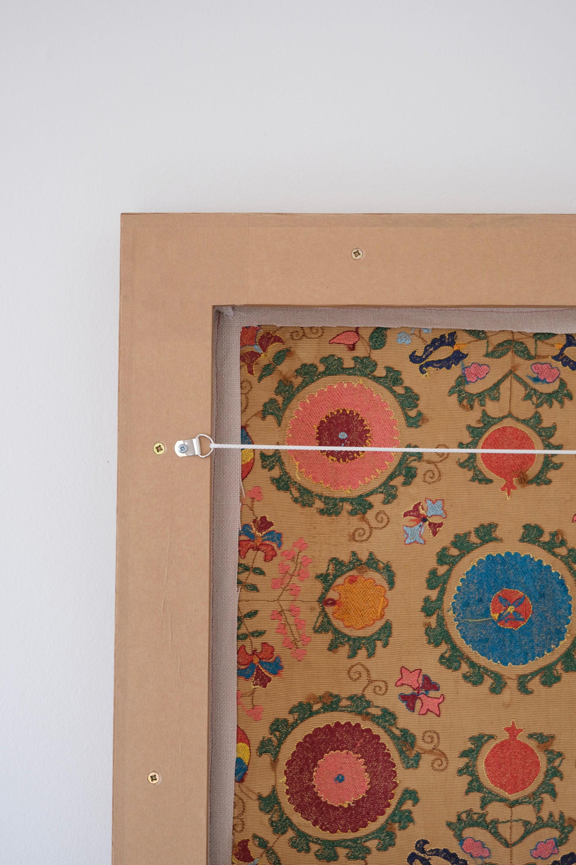 Framed antique suzani, framed textile, embroidered textile art, wooden frame, backside