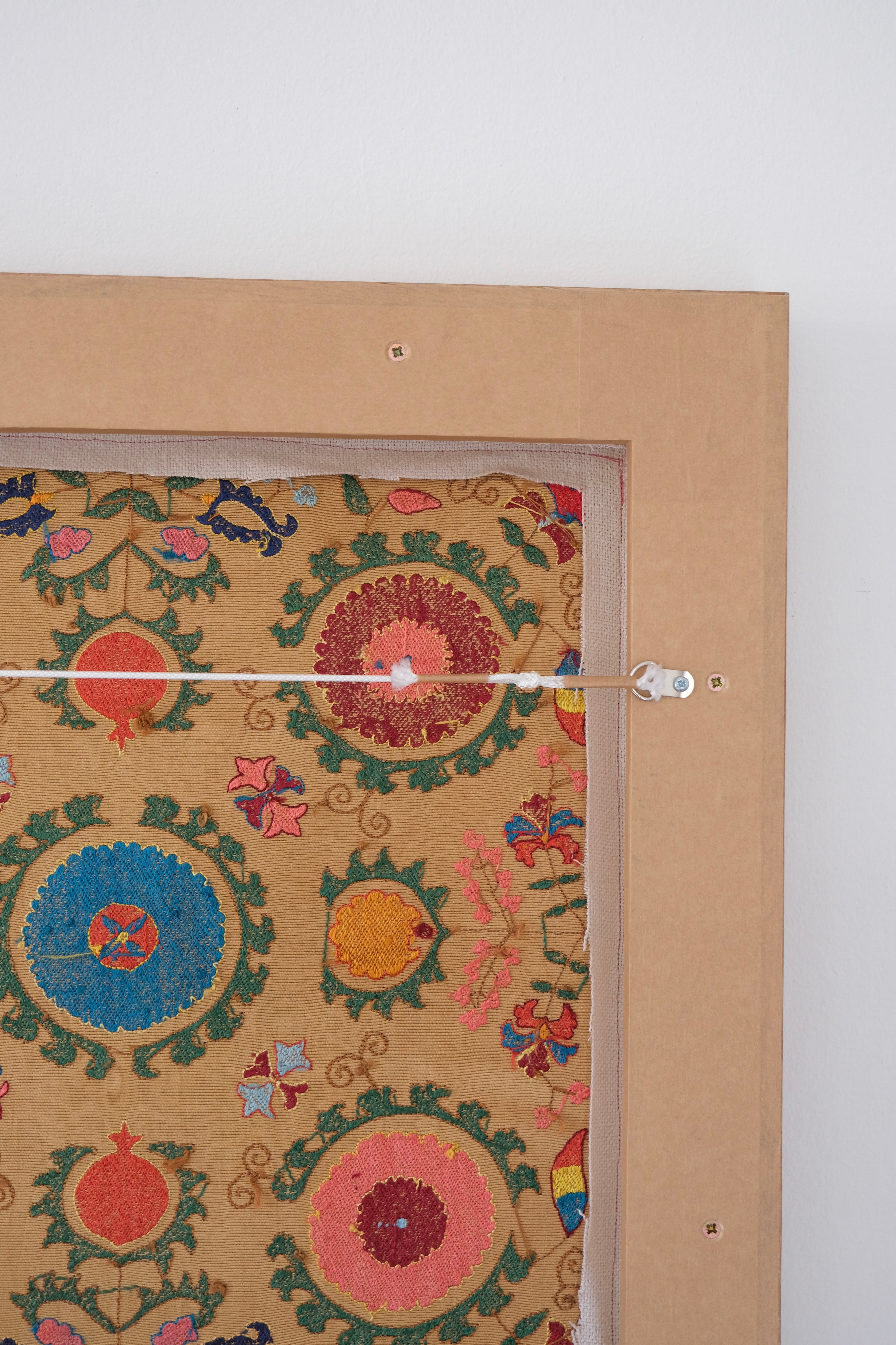Framed antique suzani, framed textile, embroidered textile art, wooden frame, backside