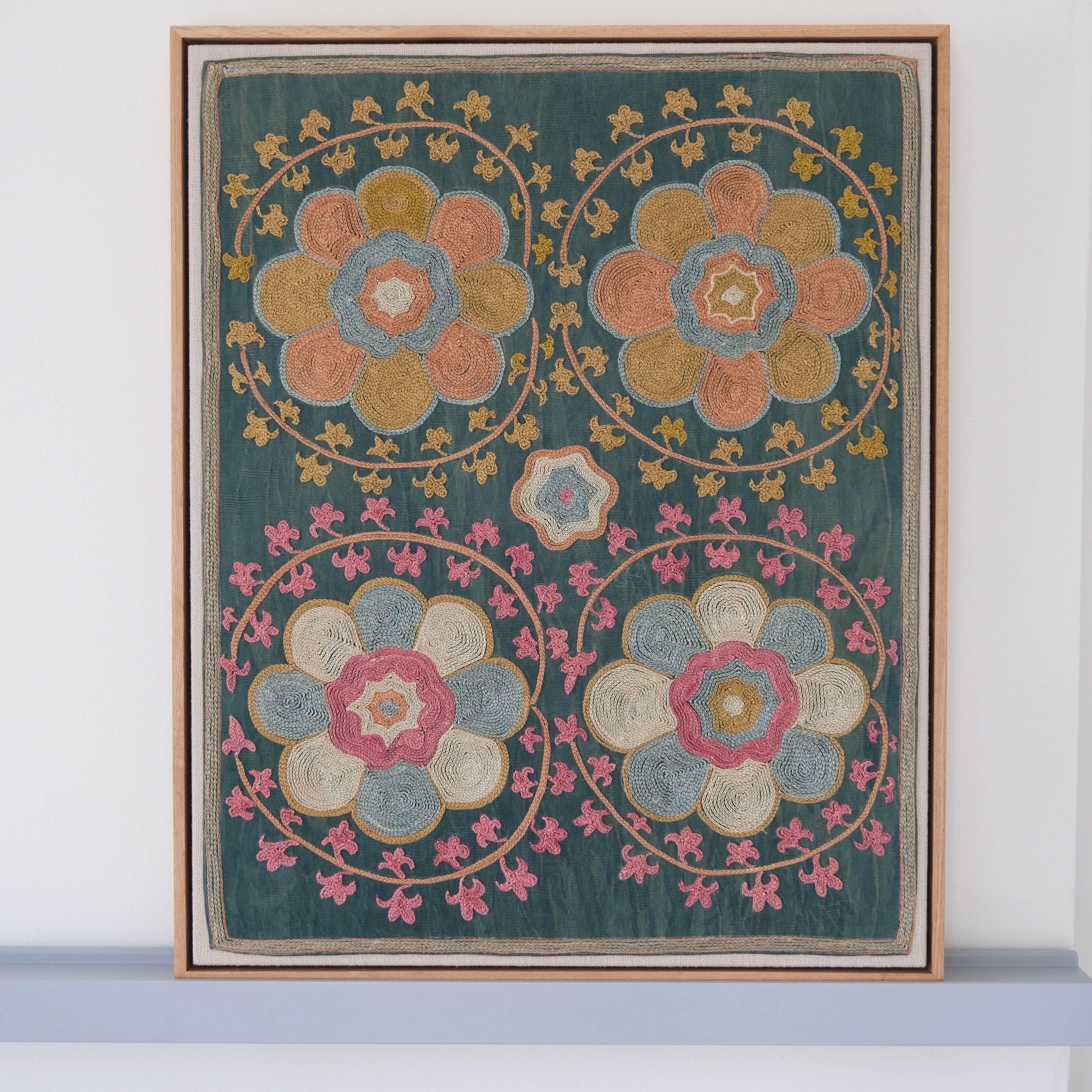 Framed suzani, embroidered textile art, wooden frame, green with orange and pink floral motifs
