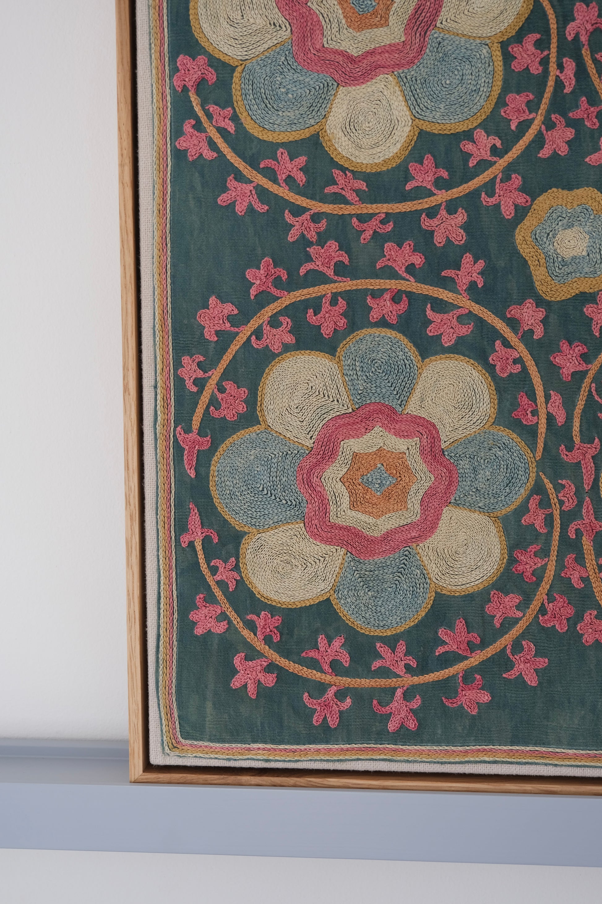Framed suzani, embroidered textile art, wooden frame, green with florals