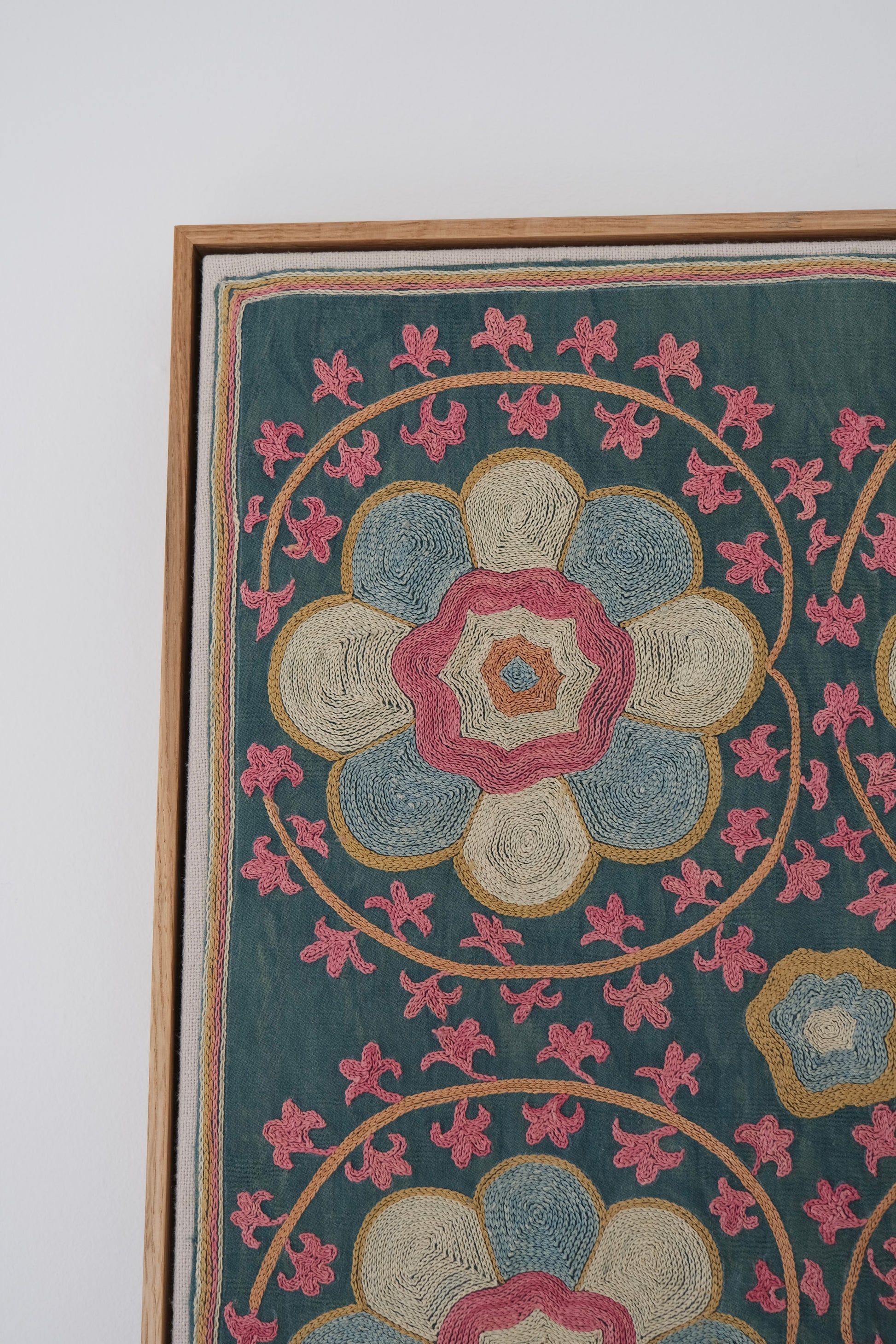 Framed suzani, embroidered textile art, wooden frame, green with florals