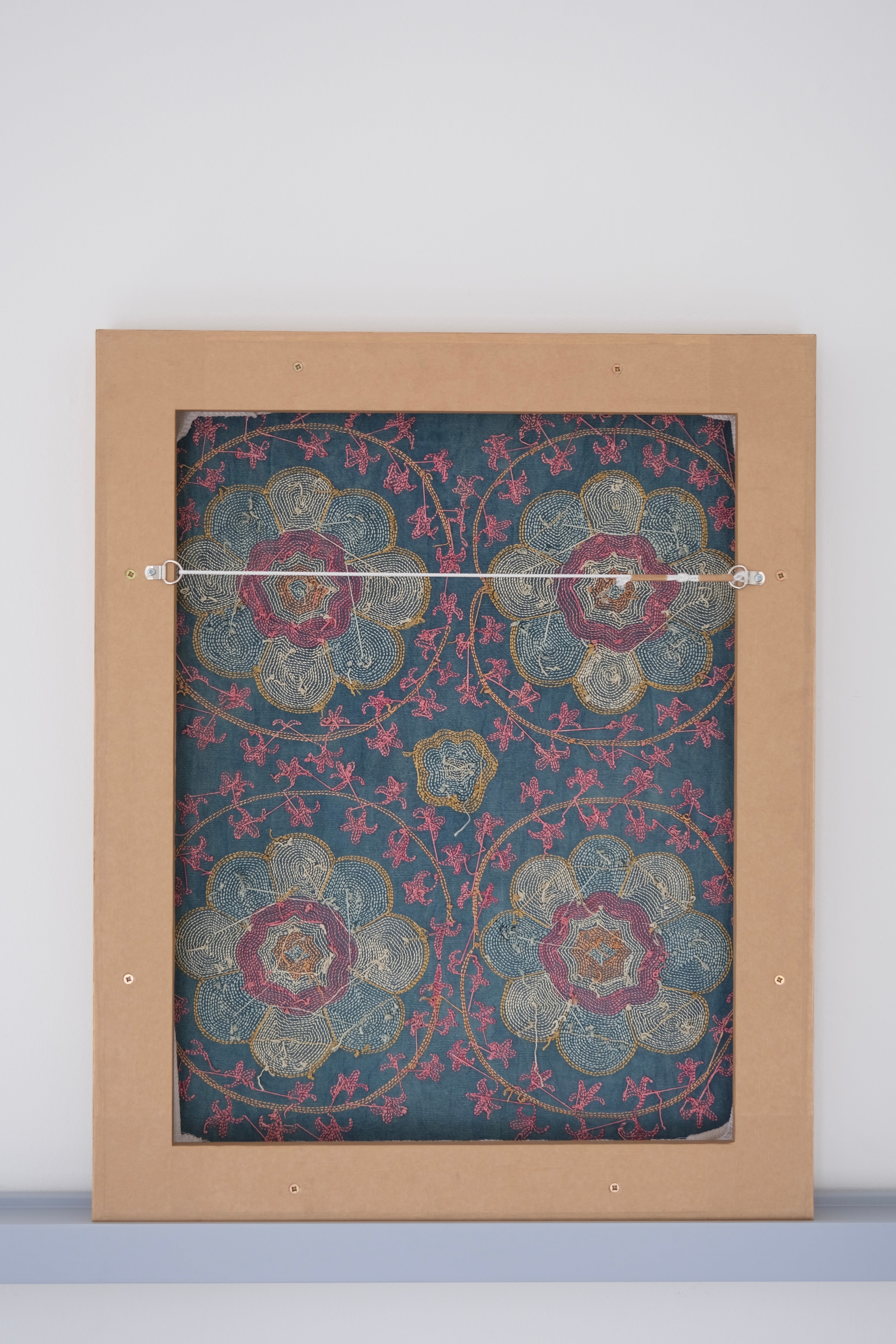 Framed suzani, embroidered textile art, wooden frame, green with florals, backside