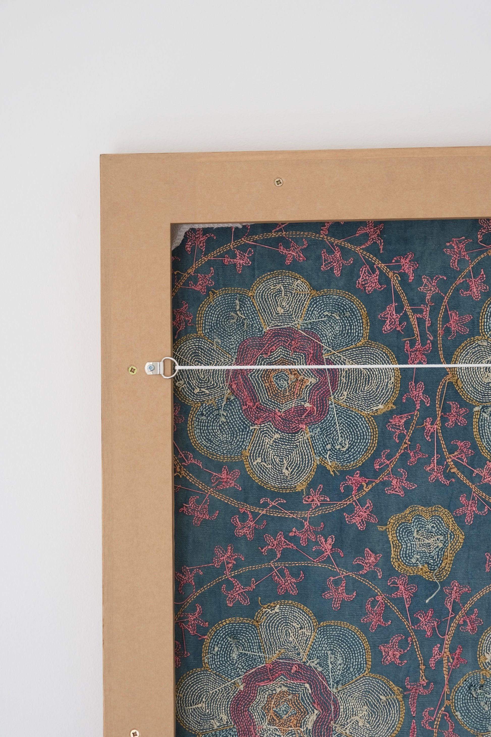 Framed suzani, embroidered textile art, wooden frame, green with florals, backside