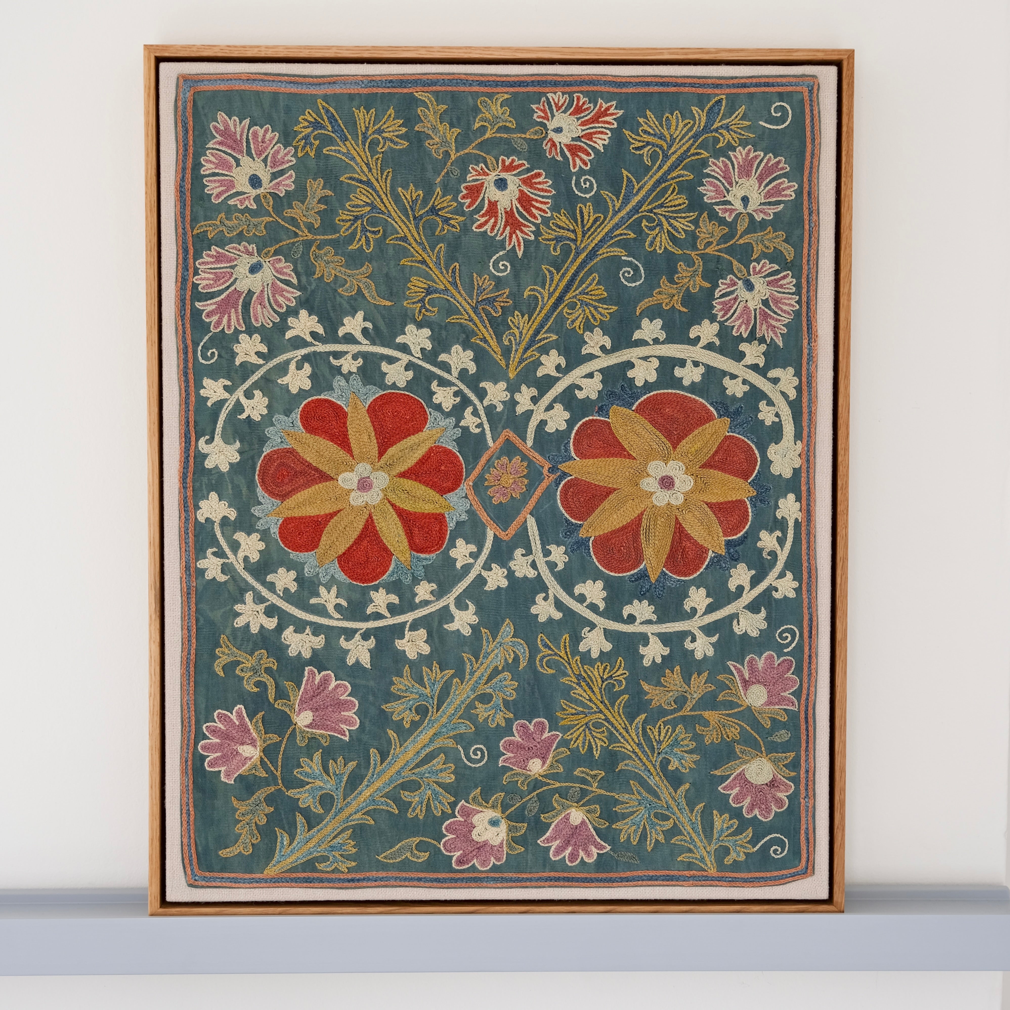Framed suzani, embroidered textile art, wooden frame, green with floral motifs