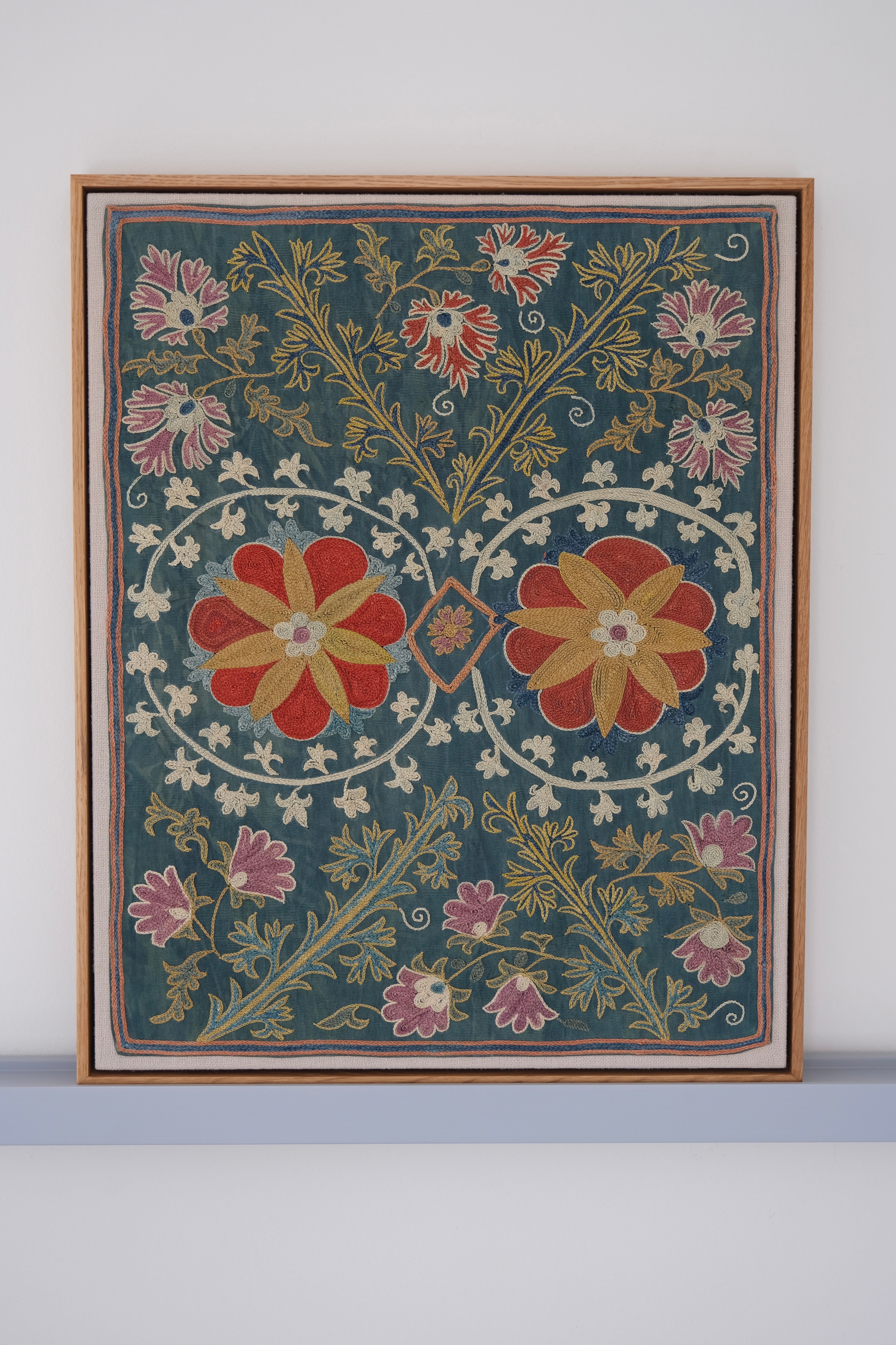 Framed suzani, embroidered textile art, wooden frame, green with floral motifs