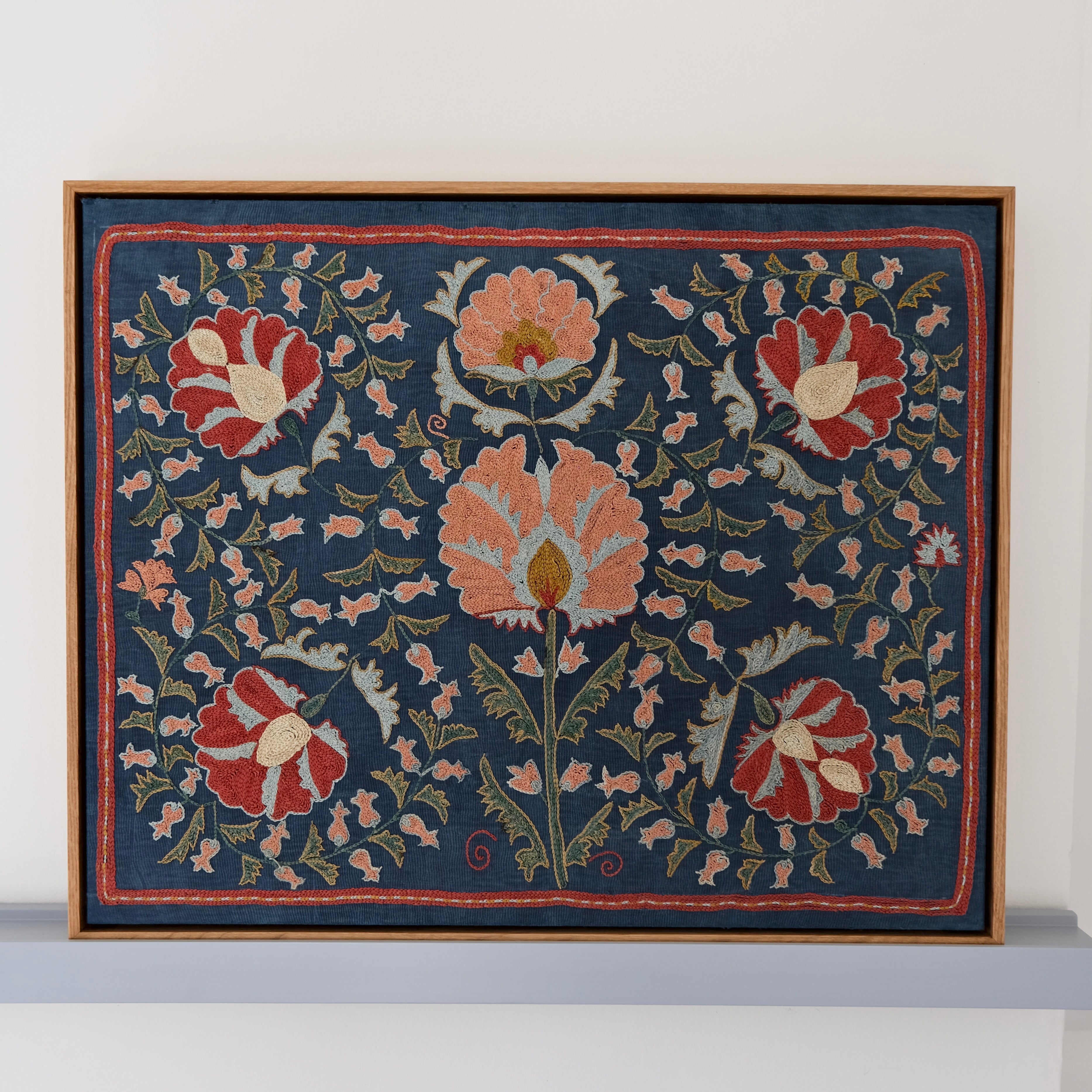 Framed suzani, embroidered textile art, wooden frame, navy blue with floral motifs