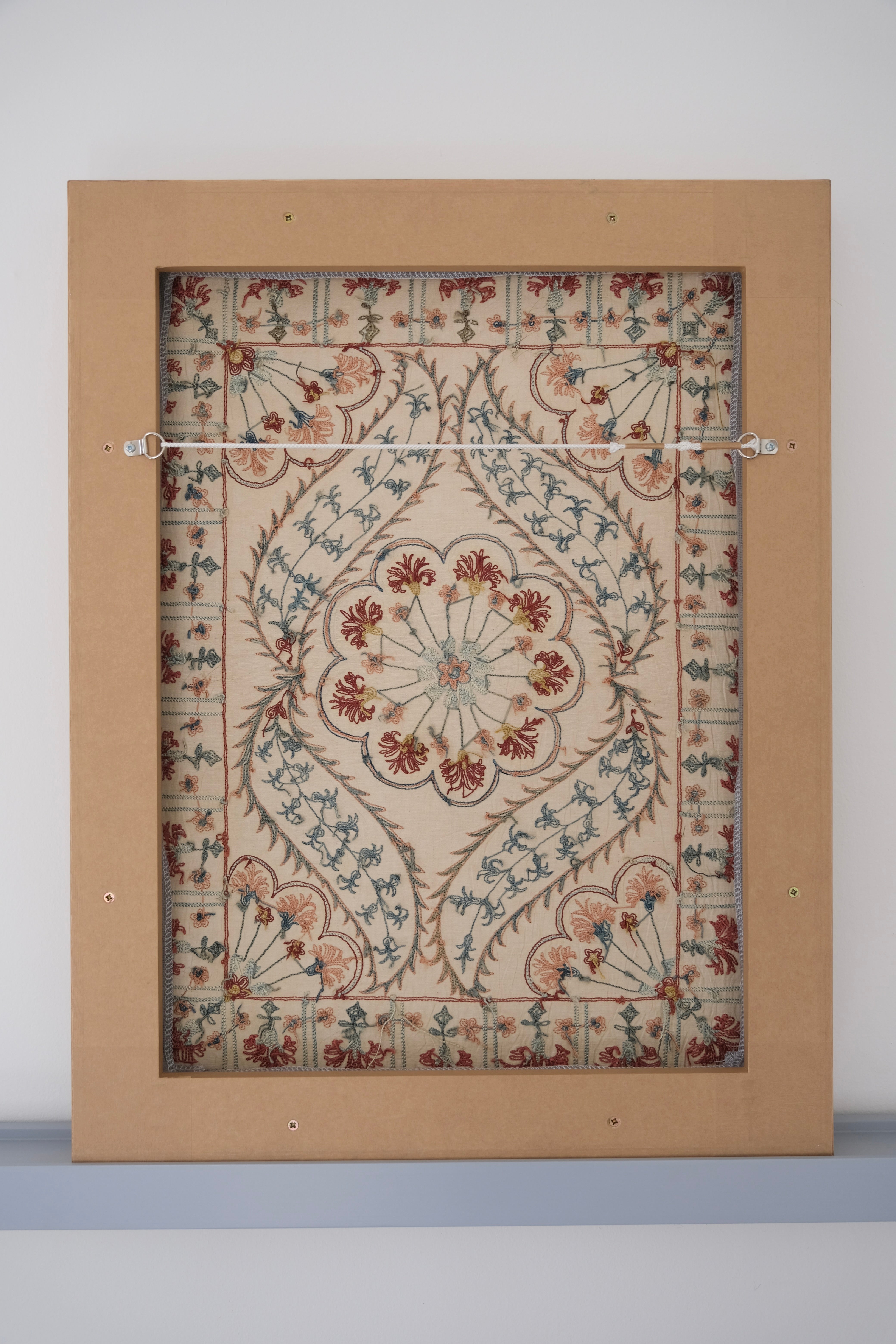 Framed suzani, embroidered textile art, wooden frame, white with blue and pink design, backside
