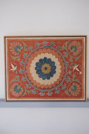Framed suzani, embroidered textile art, wooden frame, dark orange with blue and green floral motifs
